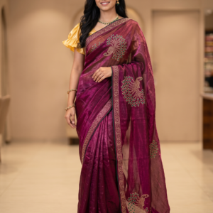 Purple Fendy satin saree with green stone peacock motif and embellished border